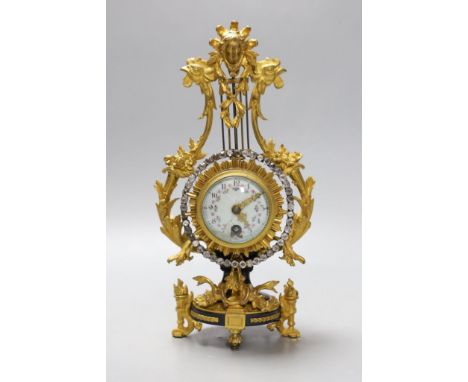 An early 20th century French ormolu mounted miniature lyre clock, 24 cm time