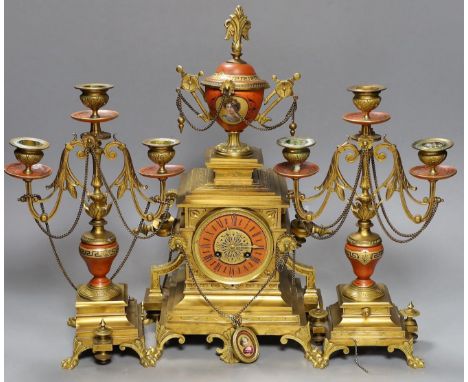 A late 19th century French Etruscan revival ormolu and porcelain mounted three piece clock garniture, 40cm