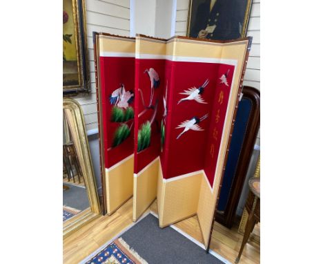 A modern Chinese faux bamboo embroidered eight fold dressing screen decorated with cranes, each panel 43cm x 176cm.
