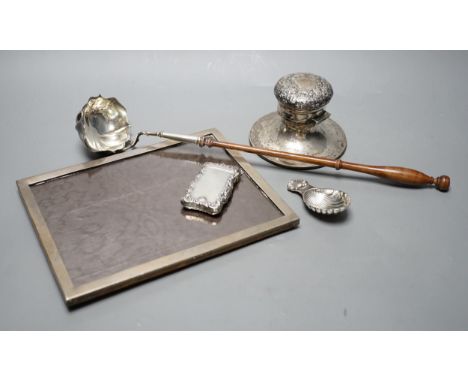 A silver mounted rectangular photograph frame, a modern silver mounted toddy ladle, a silver vesta case, a modern silver cadd