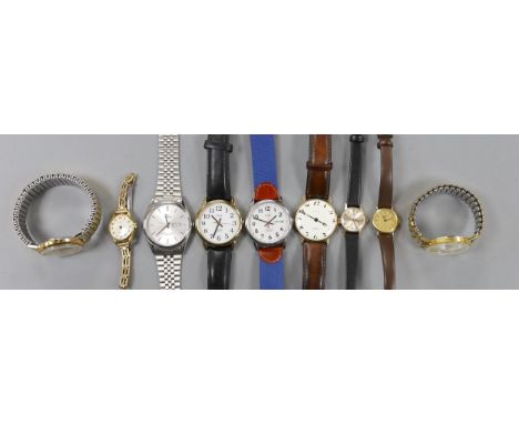 A lady's yellow metal Omega manual wind wrist watch and a group of assorted wrist watch including Lorus, Timex etc.