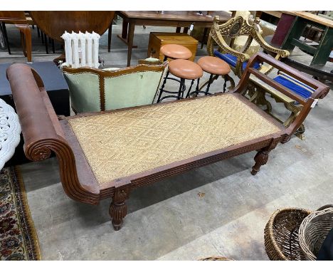 An Indonesian caned hardwood daybed, length 212cm, depth 71cm, height 84cm