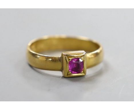 A Victorian 22ct gold and single stone gypsy set ruby ring, size M, gross weight 3.9 grams.