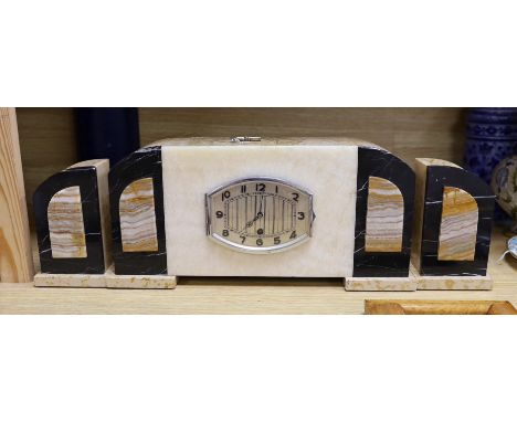 An Art Deco onyx and marble clock garniture, The clock 43 cm wide