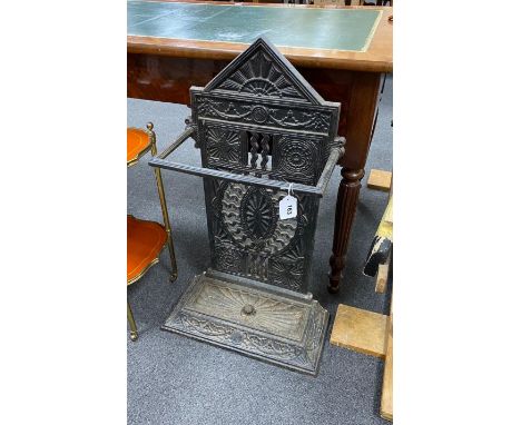 A Victorian Coalbrookdale style cast iron stick stand with pierced paterae decoration width 41cm, depth 20cm, height 80cm.