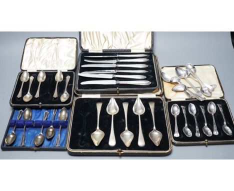 A case set of six George V silver Kings pattern coffee spoons, a cased set of six silver handled cake knives, three other inc