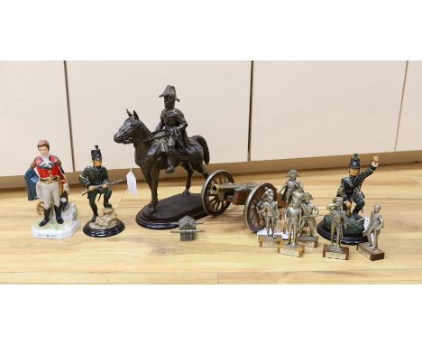 Duke of Wellington and Napoleonic war interest – a group of composition and ceramic figures of soldiers, a model of a cannon,