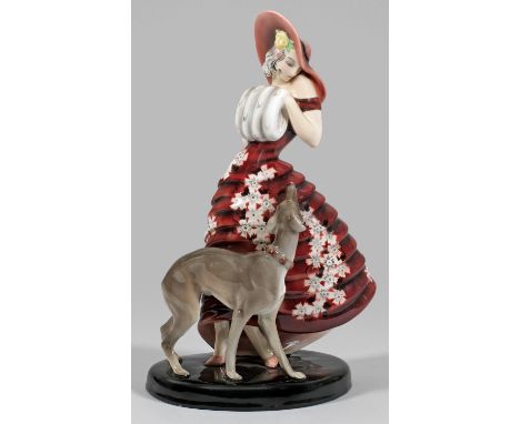 Art Déco-Figur einer Dame mit Windhund Steingut. Auf ovalem, schwarzem Sockel stehende junge Dame in einem blütengemusterten 