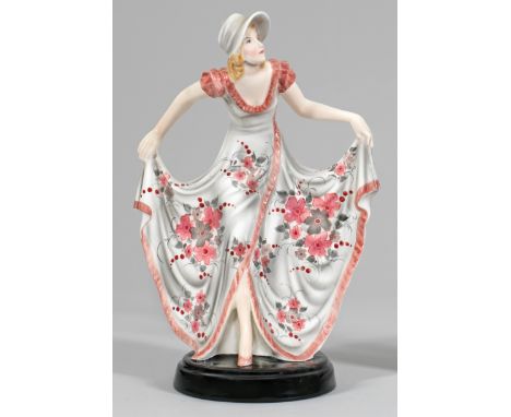 Art Déco-Figur "Kongress". Originaltitel Steingut. Auf rundem, schwarzem Sockel, in Tanzhaltung stehende junge Dame mit weit 