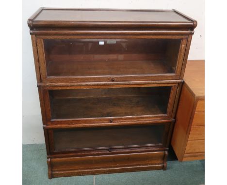 A 20th century oak Globe Wernicke ltd three tier sectional bookcase, 115cm high x 87cm wide x 31cm deep Condition Report:Avai