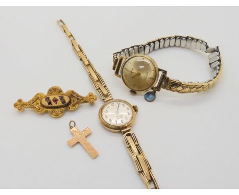 A ladies 9ct gold Rotary watch and strap, a further ladies 9ct watch head, 9ct cross and a 9ct brooch, weight together with m