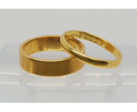 A bright yellow metal ring, size L, weight 4.2gms, and a 22ct gold wedding ring with Chester hallmarks for 1939, size K, weig