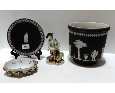 A black jasperware planter and similar plate, a Dresden figure of a man with bagpipes and a Meissen basket, lacking handle Co