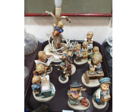 A group of Hummel figures and a table lamp Condition Report:Not available for this lot.