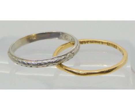 An 18ct gold wedding ring size R, weight 1.5gms, together with a platinum wedding ring with engraved pattern, size P1/2, weig