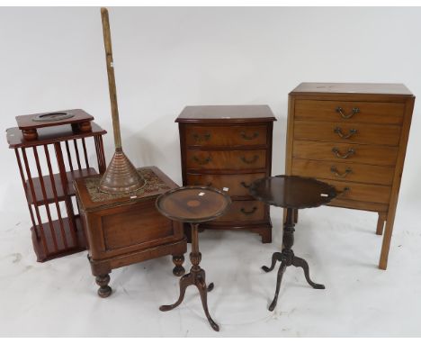 A mixed lot to include mahogany music cabinet, four drawer chest, oak commode, revolving bookcase, two mahogany wine tables e