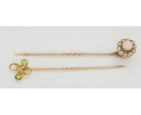 A bright yellow metal peridot and pearl stick pin, together with a yellow metal opal and pearl pin, weight together 3.1gms Co