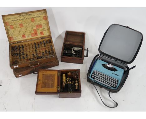 A boxed lot of four cased scientific instruments and a typewriter (5) Condition Report:Available upon request