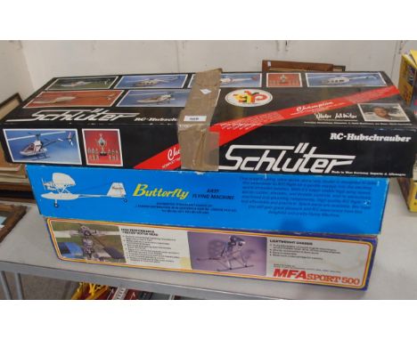 A lot of boxed model helicopters, MFA Sport 500, Schutter Scout 60, Schutter Champion with a Butterfly ARTF Flying Machine an