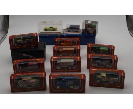 A model of an East German Trabant motor car mounted upon a debris of the Berlin Wall together with various Corgi and Weetabix