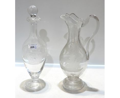 A Victorian glass ewer with etched decoration of figures and a camel in a landscape, together with a decanter etched with the