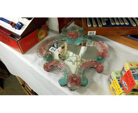 A Murano glass mirror
