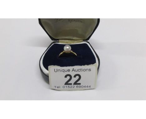 An 18ct gold diamond and pearl ring, size P