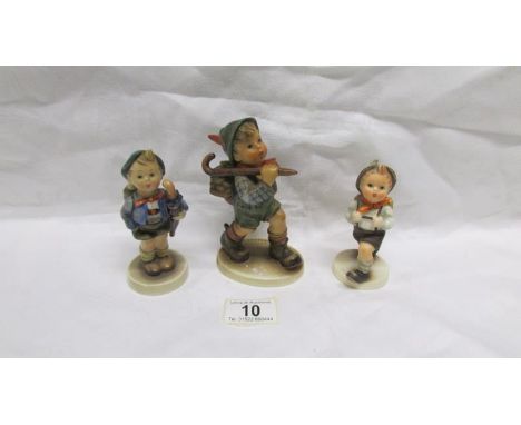 A large Hummel Rambler figure and 2 medium Hummel figures