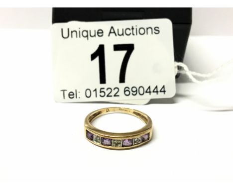 A diamond and amethyst 7 stone yellow gold ring, size K