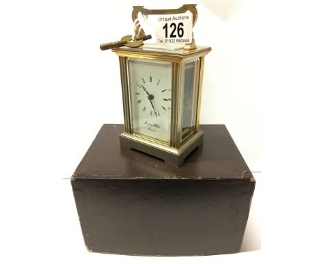 A brass carriage clock in original box marked Morrell & Hilton, Huntingdon, (Overwound)