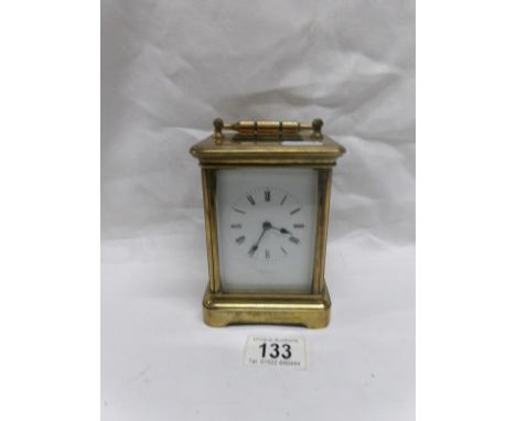 A brass carriage clock (rear glass a/f)