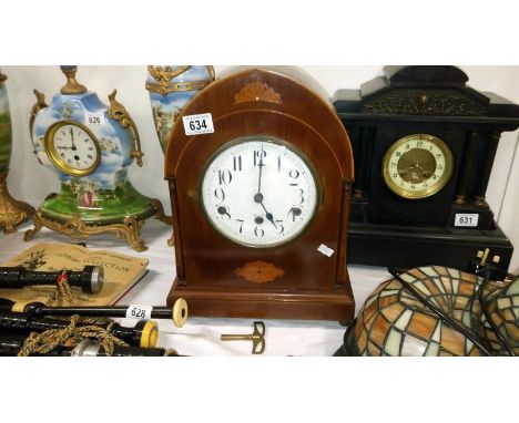 A mahogany inlaid mantel clock