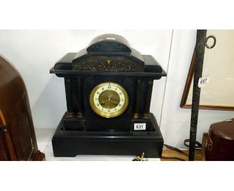 A black slate mantel clock