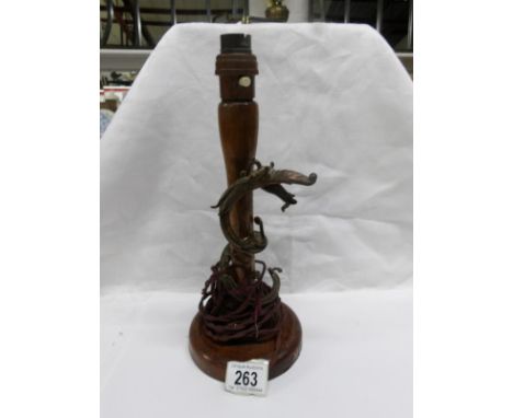 An oriental table lamp base with entwined dragon