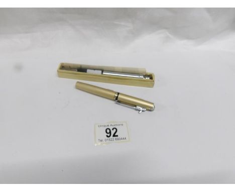A Nura lighter-writer propelling pencil and a Peter lighter in the form of a pen