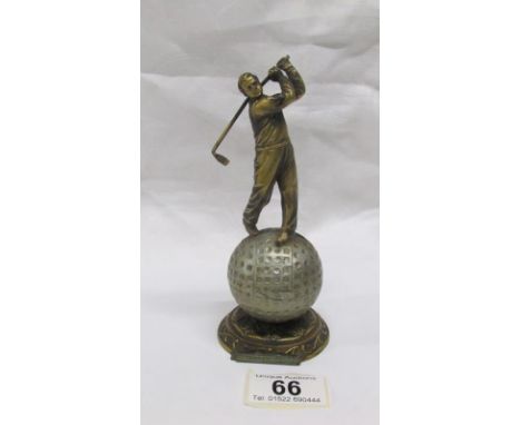 An art deco spelter Lorenzl style striker lighter in the form of a golfer (missing wand)