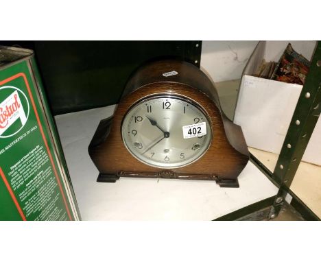 An oak mantel clock