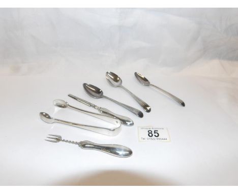 3 silver tea spoons, a silver pickle fork, silver sugar tongs and one other silver item