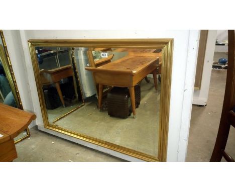 A gilt framed bevel edged mirror