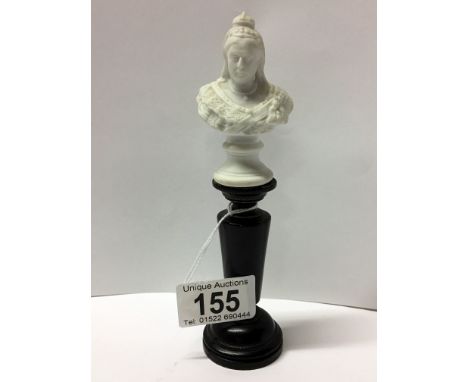 A small parian bust of Queen Victorian marked R Beit 1897, made in Germany, on turned wooden pillar