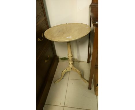 A shabby chic tripod table