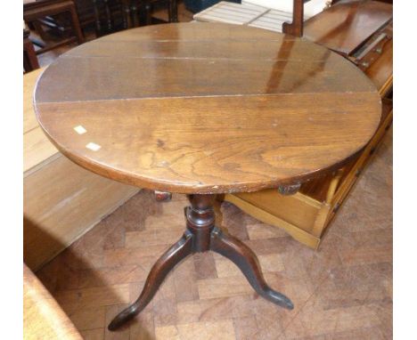 A George III oak tripod table, 68cm diameter Condition reports cannot be done for our Interiors sales.