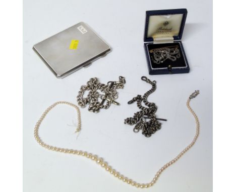 An engine turned silver card case and two silver watch chains, a strand of cultured pearls etc. Condition reports cannot be d