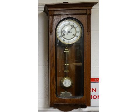 Oak cased wall clock with painted enamel face 