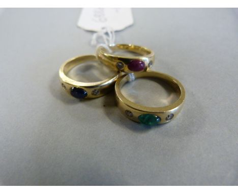 A trio of 14 carat gold rings set with Sapphire, Ruby & Emerald each with diamond shoulders. Total weight 14 gms approx