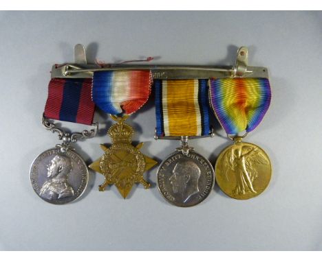 A group of four George V First World War medals comprising, Distinguished Service Medal, 1914-15 Star, British War Medal, Vic