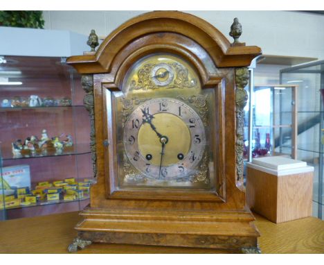 A walnut veneered bracket clock with brass and silvered dial- 1 finial replaced- pendulum and key in office