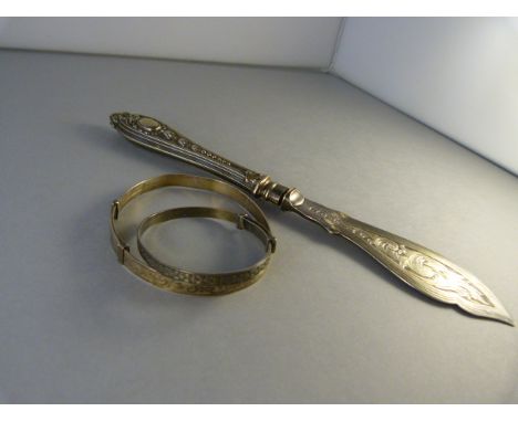 A sterling silver christening bangle, and a hallmarked silver bangle (weight -16.1g) and a silverplated butterknife