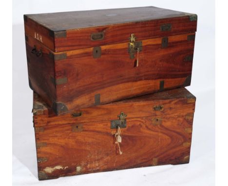 A LATE 19TH CENTURY COLONIAL CAMPHORWOOD TRAVELLING TRUNK with inset brass handles, 105cm wide, and another 101cm wide (2)