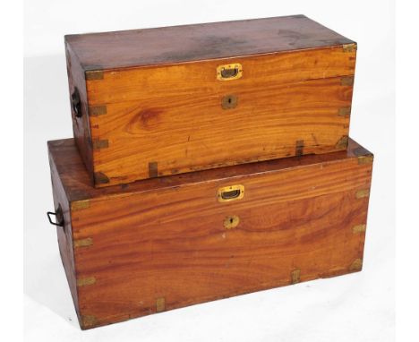 A LATE 19TH CENTURY COLONIAL CAMPHORWOOD BRASS BOUND TRAVELLING TRUNK with hinged rising lid, 80cm wide, and another 95cm wid